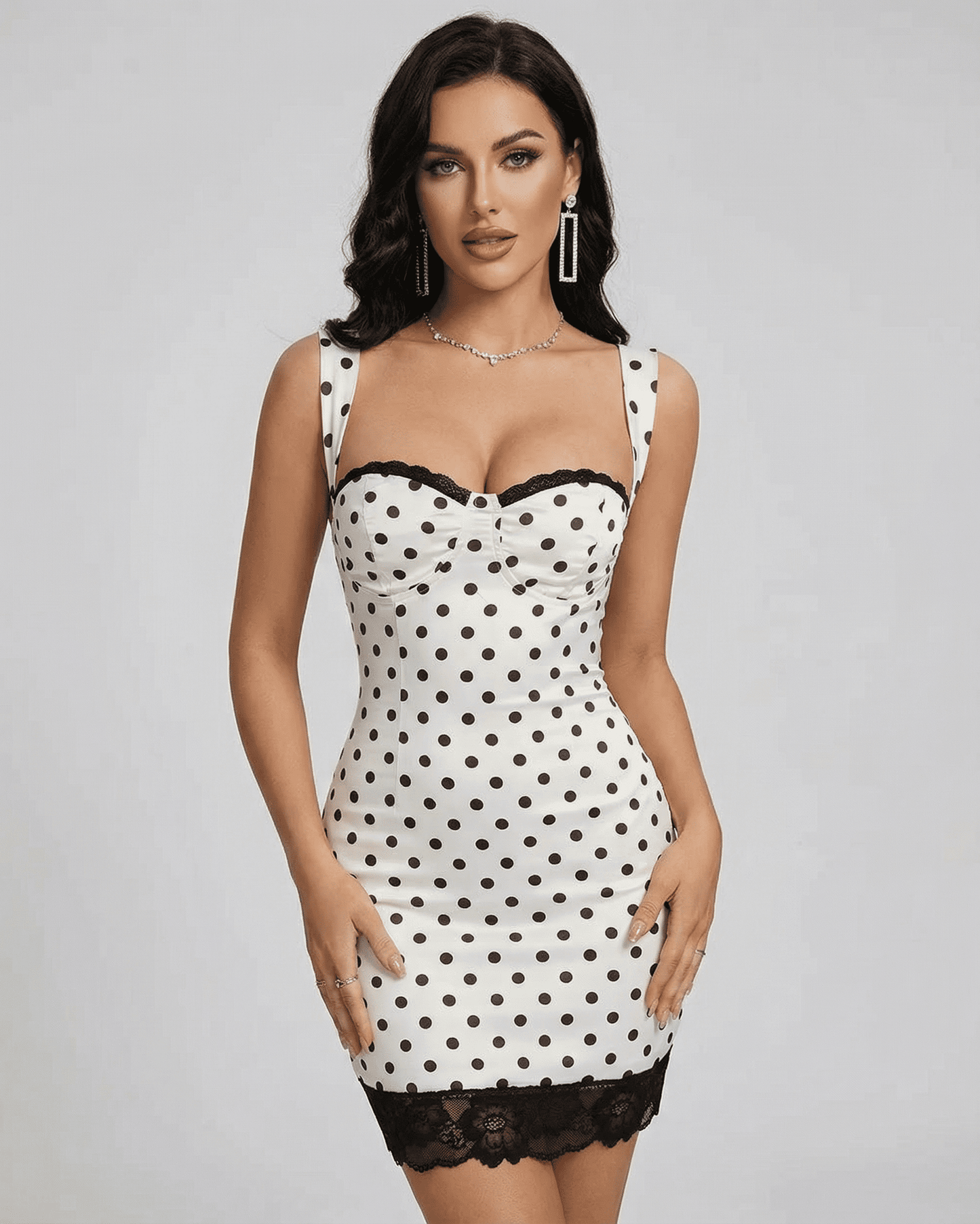 Celeste Mini Dress by SLIMONA, a stylish polka dot mini dress with lace trim and off-the-shoulder neckline.