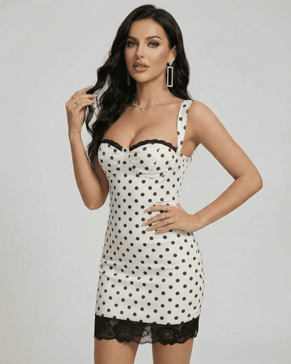 Celeste Mini Dress by SLIMONA, stylish polka dot design with lace trim and a fitted silhouette.