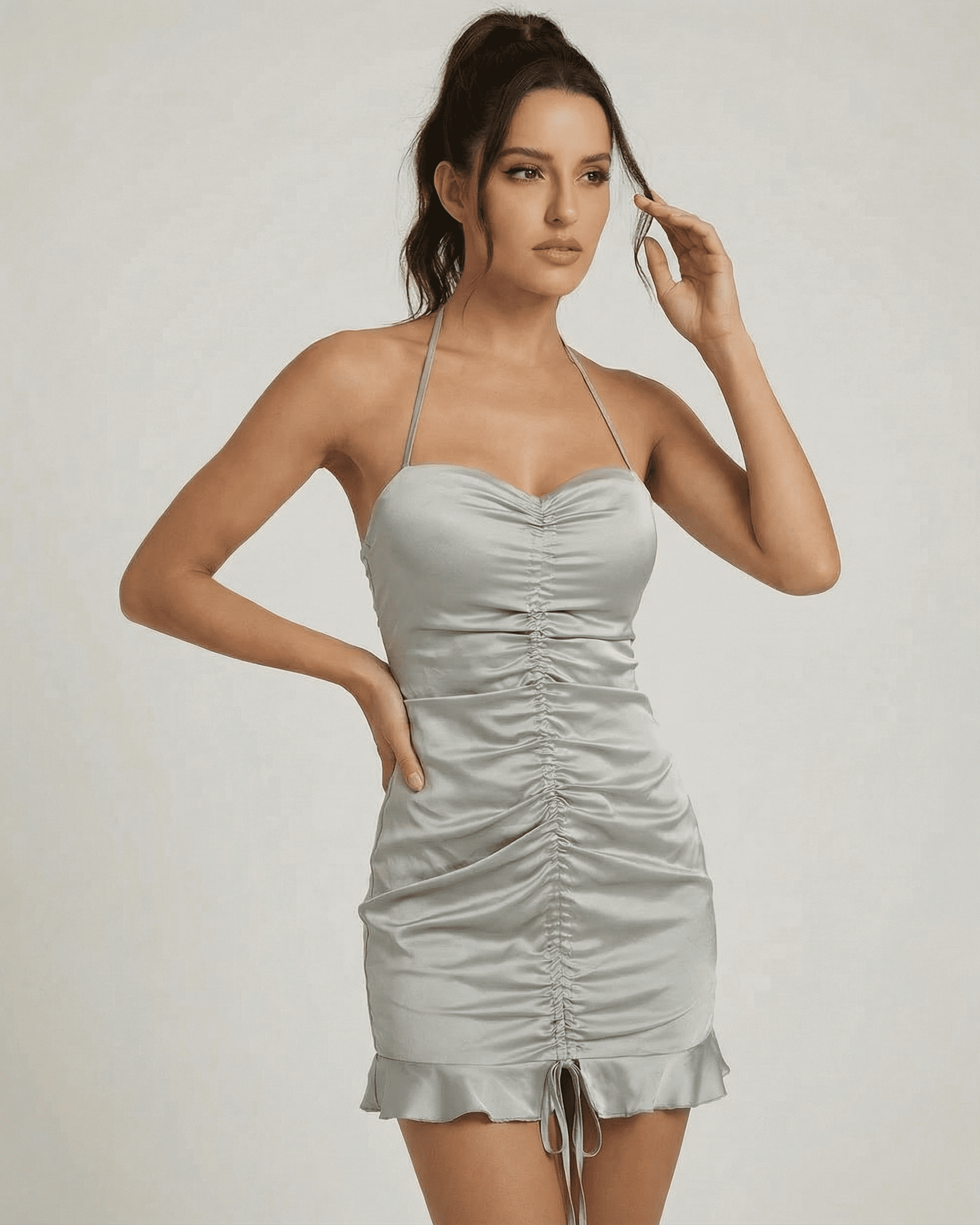 Celeste Mini Dress from SLIMONA, featuring satin-effect ruched design and elegant open back, perfect for special occasions.