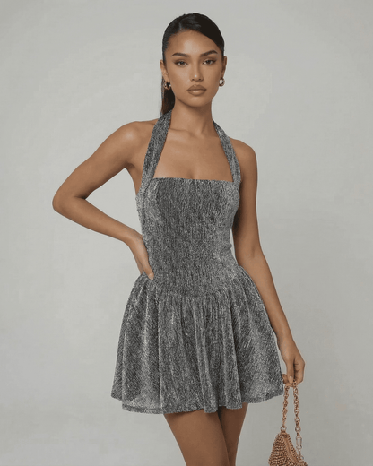 Celeste Mini Dress by SLIMONA in silver sequins, A-line silhouette, high waist, modern evening wear.