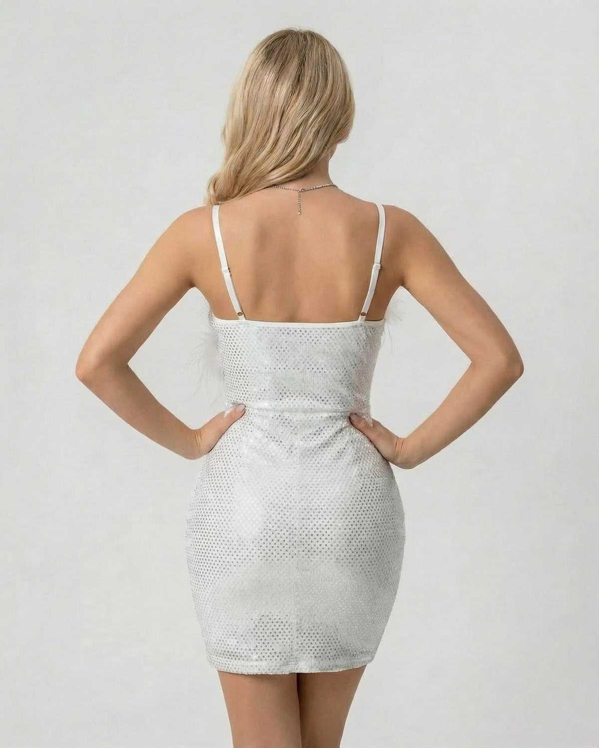 Celeste Mini Dress by SLIMONA, a stunning sequin bodycon mini with faux fur detail, showcasing a sleek silhouette.