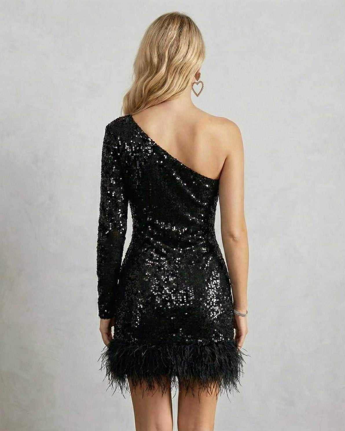 Celeste Mini Dress by Lauven, a one-shoulder black sequined dress with feather trim, perfect for evening glamour.