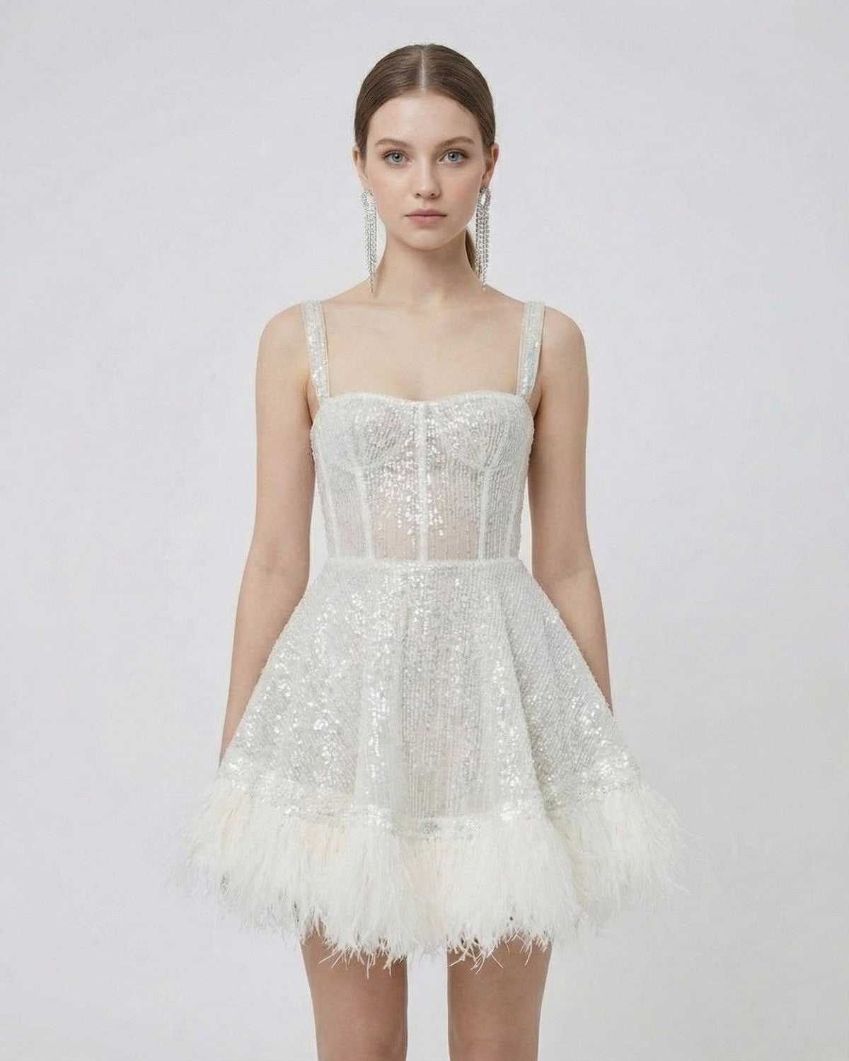 Celeste Mini Dress from SLIMONA, a silver sequin A-line mini dress with faux fur hem and spaghetti straps.
