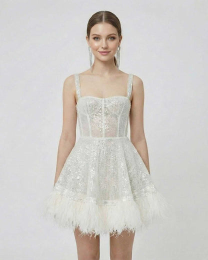 Celeste Mini Dress by SLIMONA - Silver Sequin A-Line Mini Dress with Faux Fur Hem, showcasing a modern, polished look.
