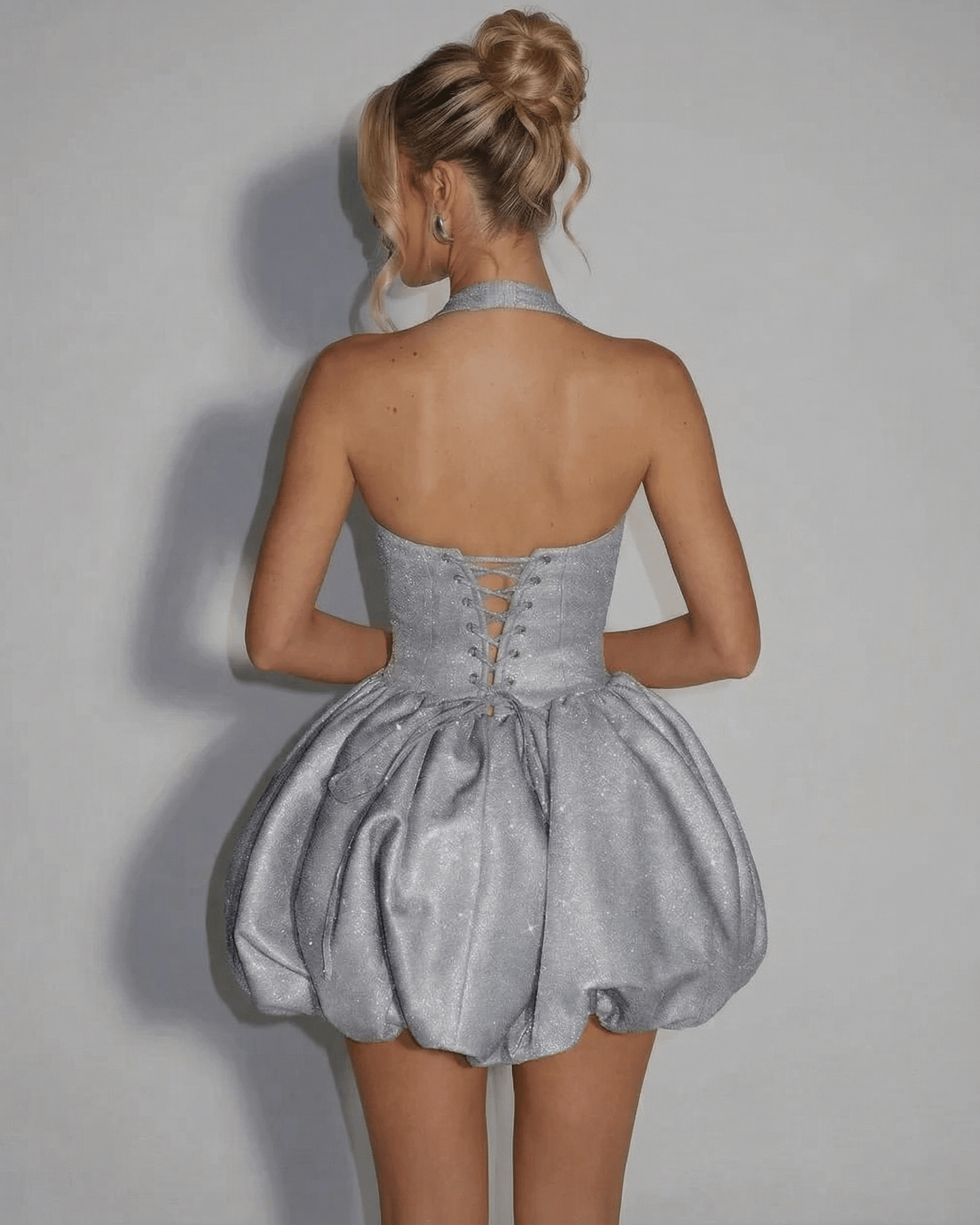 Celeste Mini Dress by SLIMONA featuring a silver sequin pouf silhouette and intricate back design.