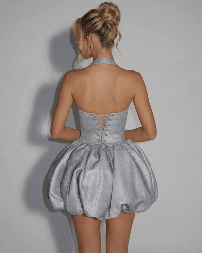 Celeste Mini Dress by SLIMONA featuring a silver sequin pouf silhouette and intricate back design.