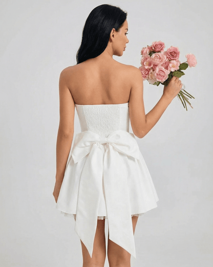 Celeste Mini Dress by SLIMONA featuring a strapless design and flared skirt, perfect for special occasions.