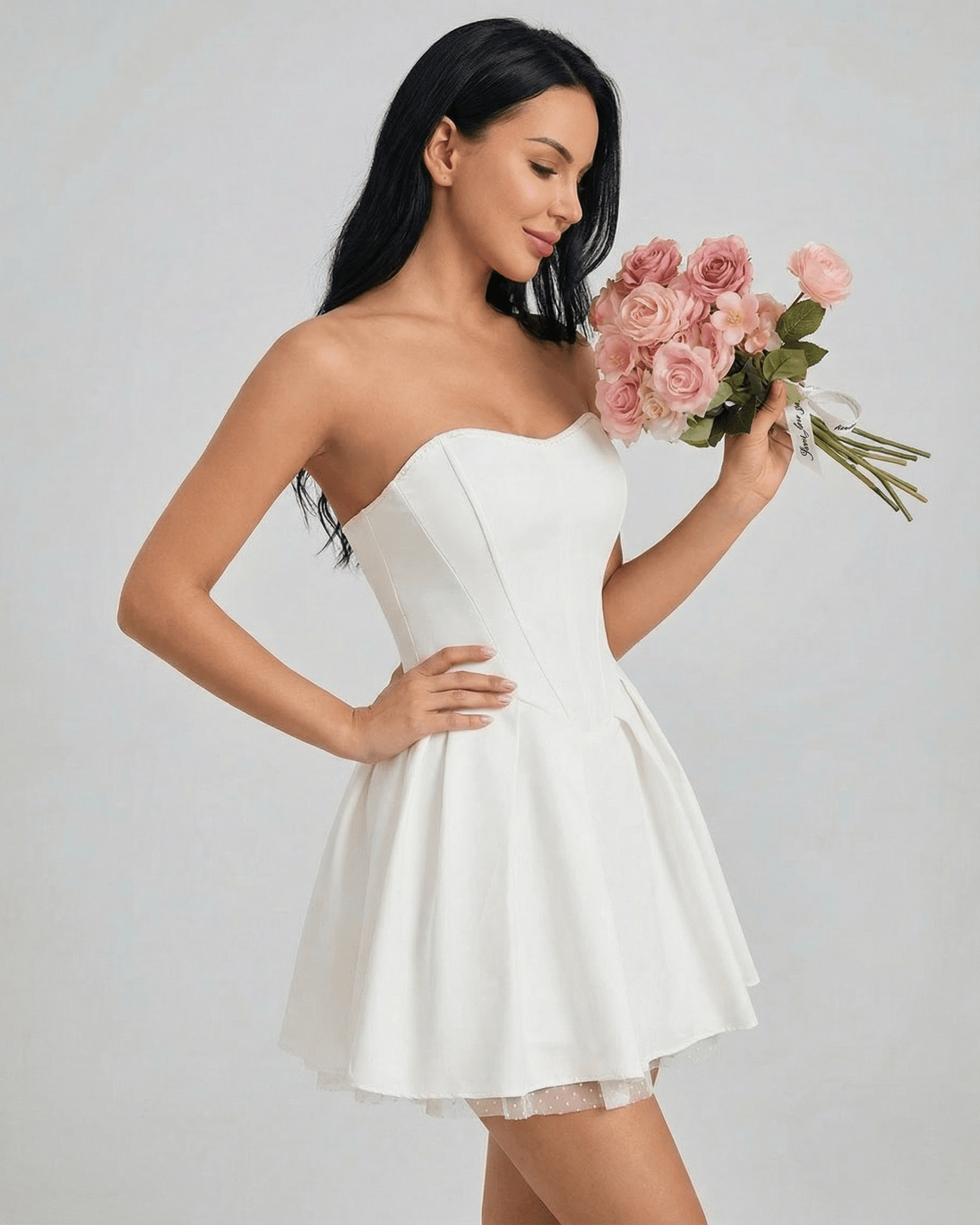 Celeste Mini Dress by SLIMONA, strapless and flared, perfect for a chic look with ease of movement.