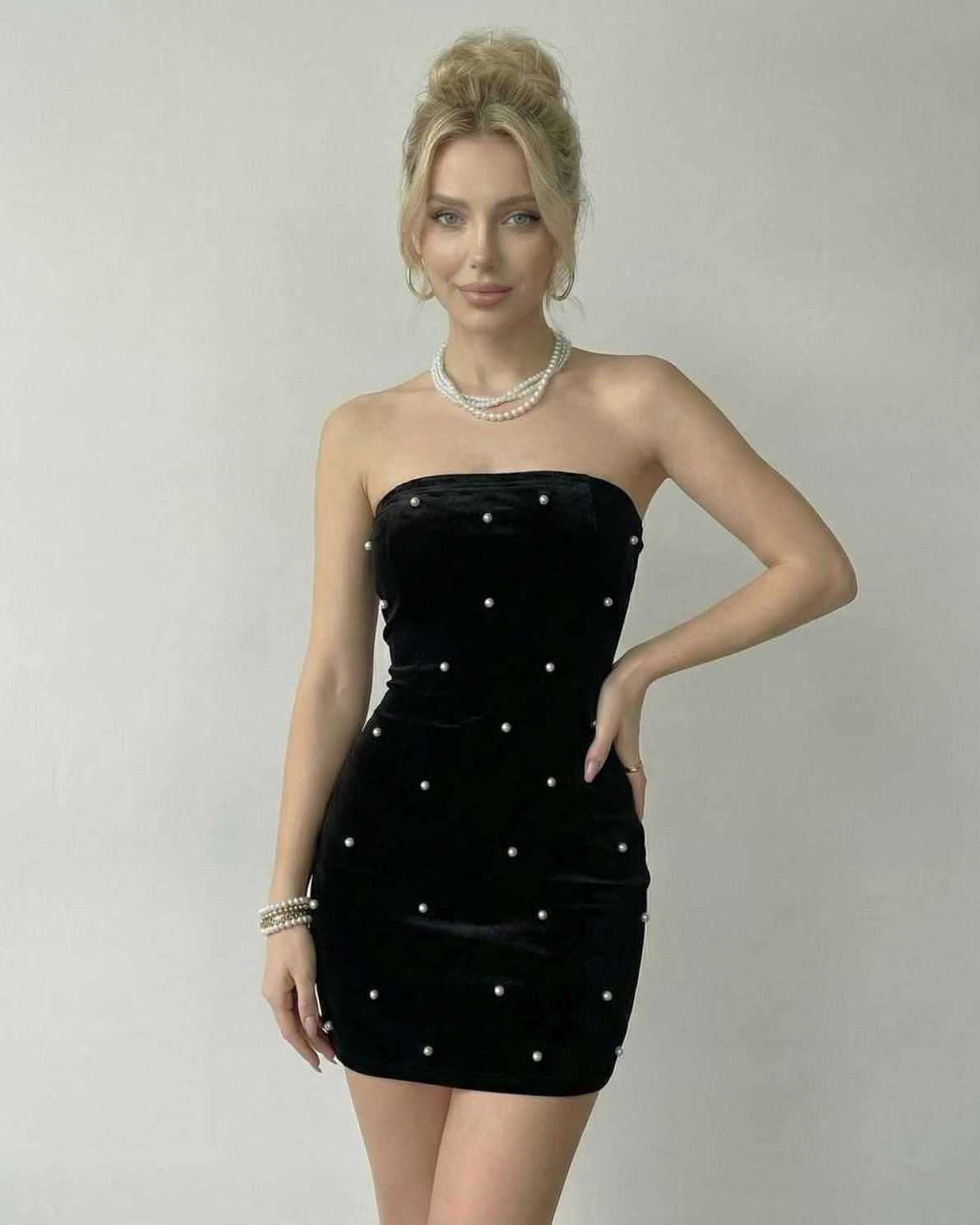 Lauven Celeste Mini Dress in black velvet with pearl accents, showcasing a strapless silhouette and form-fitting design.