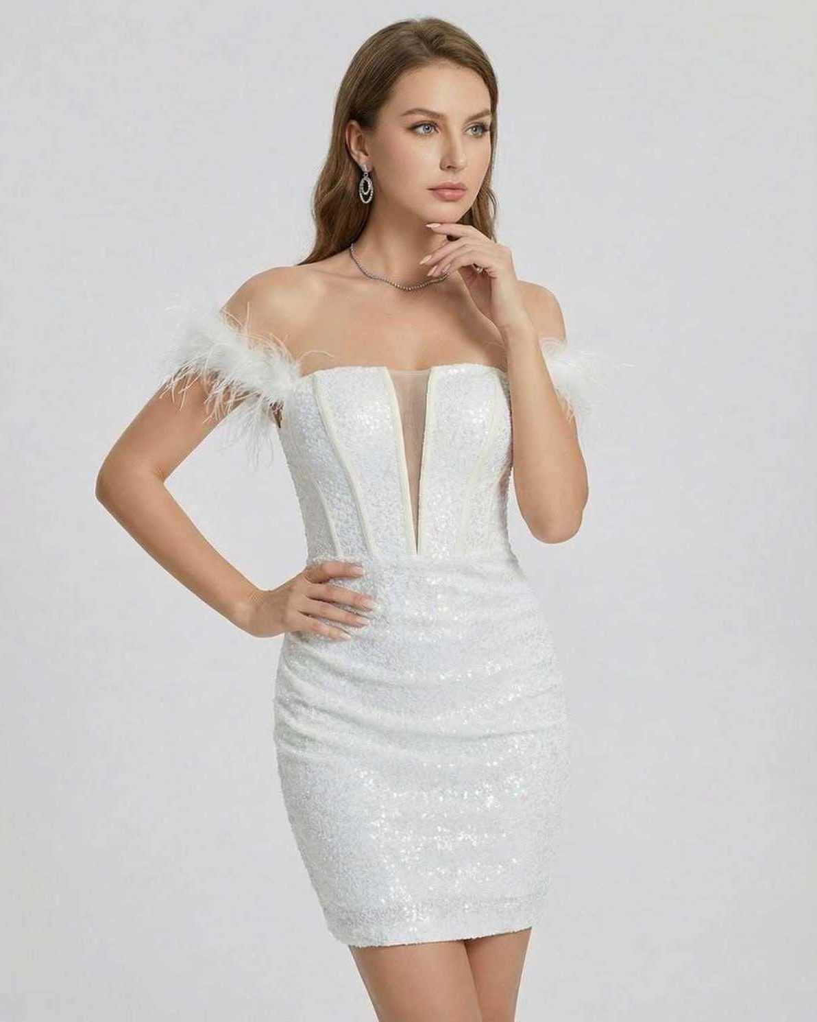 Celeste Mini Dress by Lauven, featuring off-shoulder feathered design and shimmering sequin detail in white.