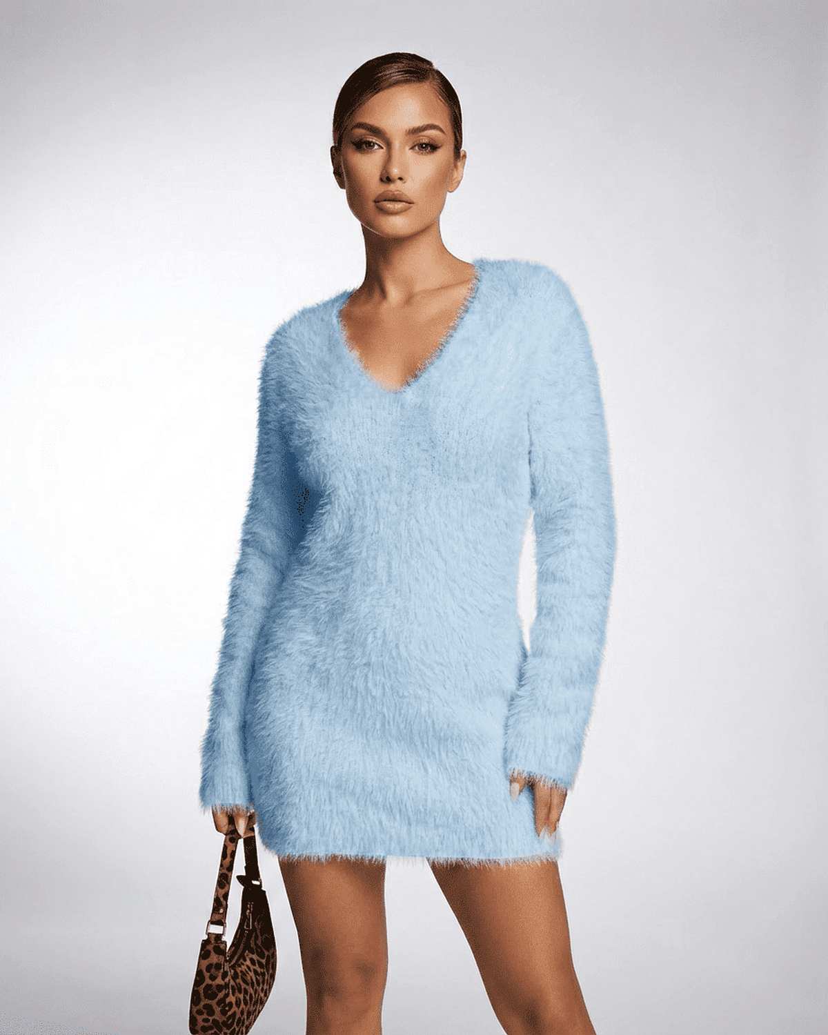Celeste Sweater by SLIMONA in light blue, featuring a V-neck and fuzzy plush knit design for cozy styling.