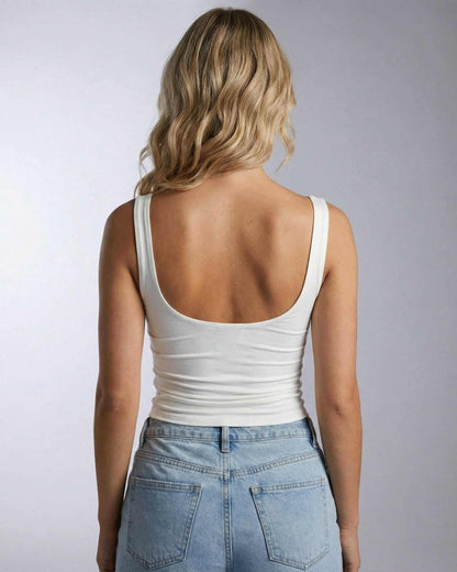 Celeste Top by SLIMONA, back view of draped sleeveless top in white, showcasing a modern elegant style.