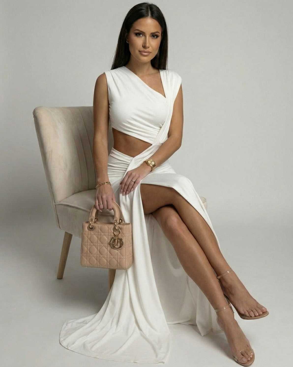 Celestine Maxi Dress by Lauven featuring a white asymmetrical cutout design on a model, showcasing modern elegance.