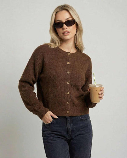 Cocoa Cardigan by Lauven on model in sunglasses, holding a drink, showcasing a relaxed fit and button-front design.