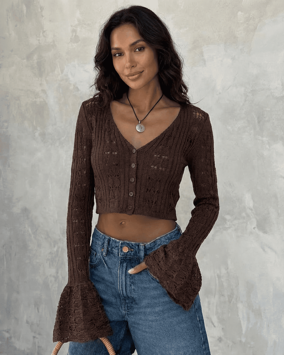 Cocoa Cardigan by SLIMONA, a cropped cotton knit with flare sleeves, showcasing elegant style and versatility.