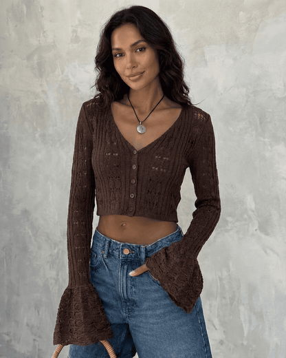 Cocoa Cardigan by SLIMONA, a cropped cotton knit with flare sleeves, showcasing elegant style and versatility.