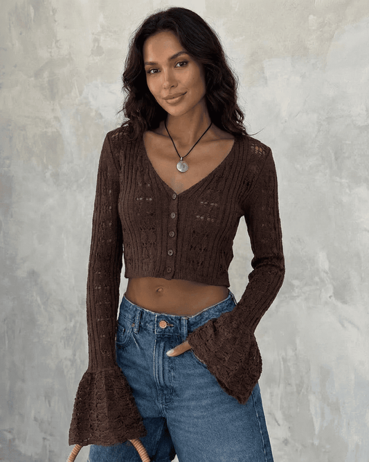 Cocoa Cardigan by SLIMONA, a cropped cotton knit with flare sleeves, showcasing elegant style and versatility.