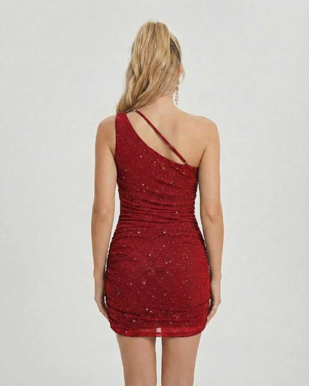 Back view of the SLIMONA Crimson Mini Dress, featuring an asymmetrical one-shoulder design and sequin detailing.