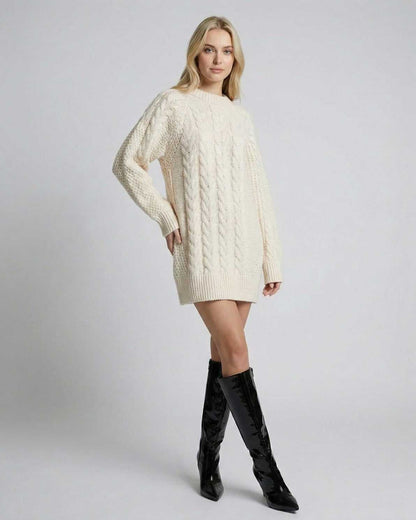 Eira Sweater by Lauven, a minimal cable-knit long sleeve sweater in cream, styled with knee-high black boots.