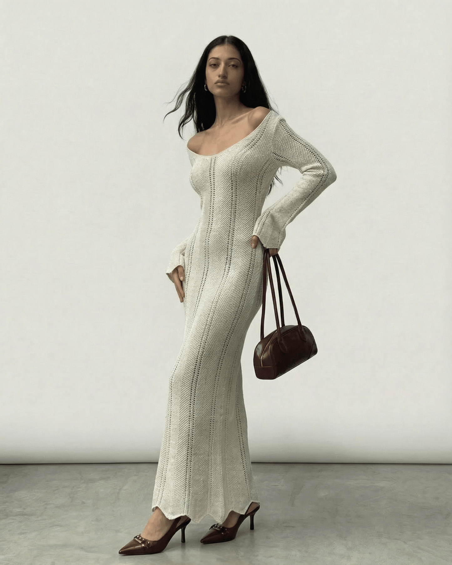 Elara Maxi Dress by Lauven, ribbed V-neck bodycon silhouette with long flare sleeves.