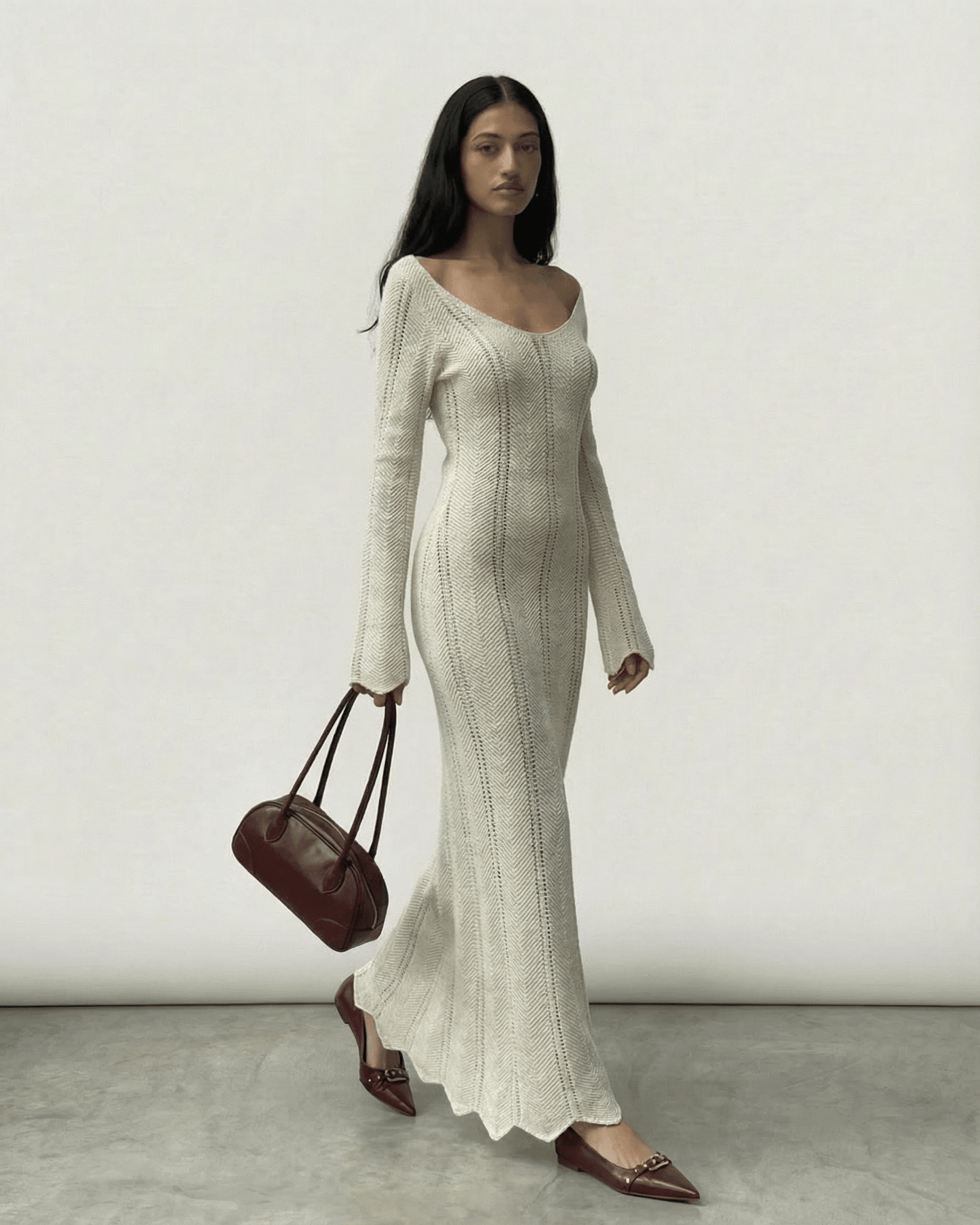 Model wearing Elara Maxi Dress by Lauven, featuring a ribbed design and flowing silhouette.