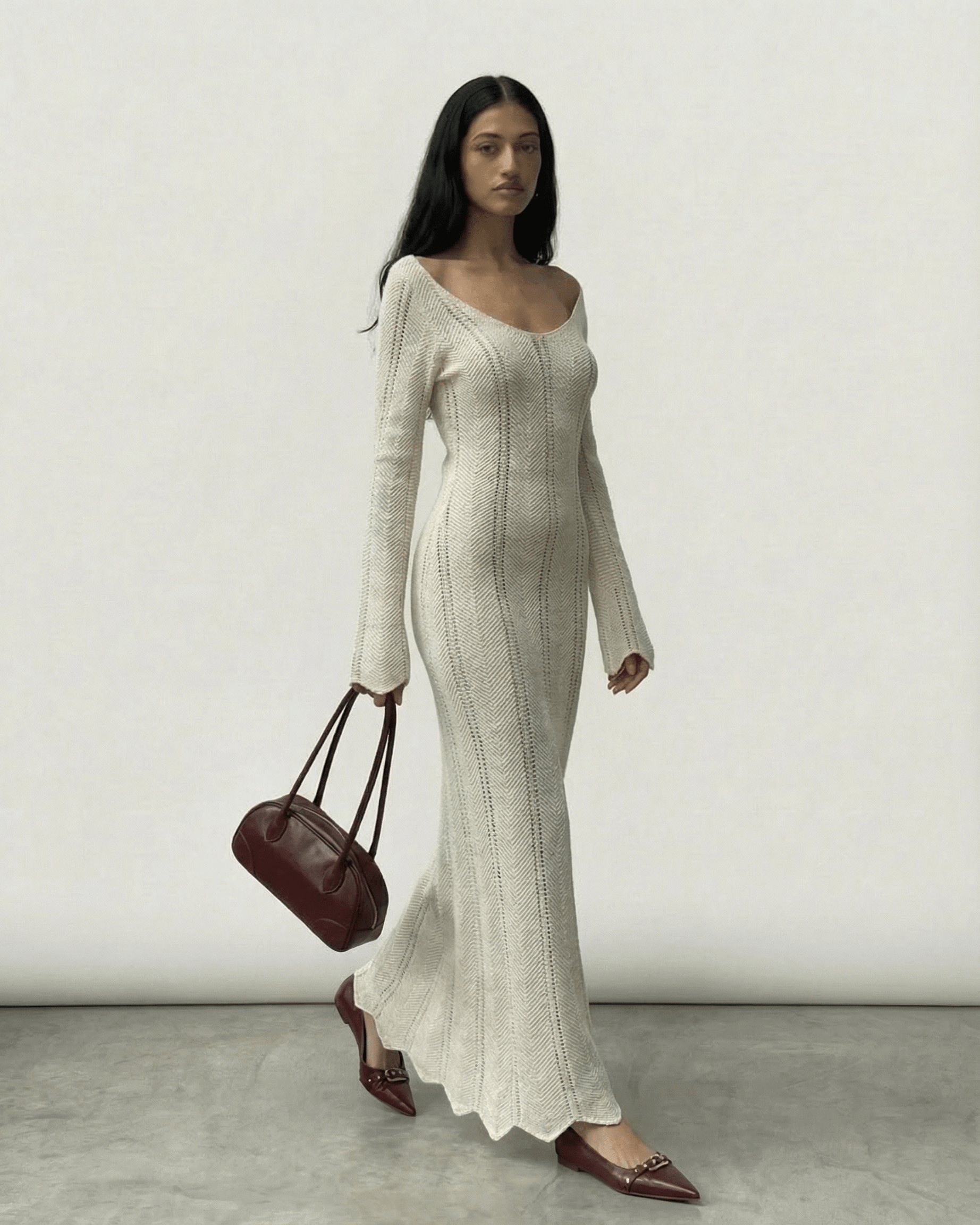 Model wearing Elara Maxi Dress by Lauven, featuring a ribbed design and flowing silhouette.