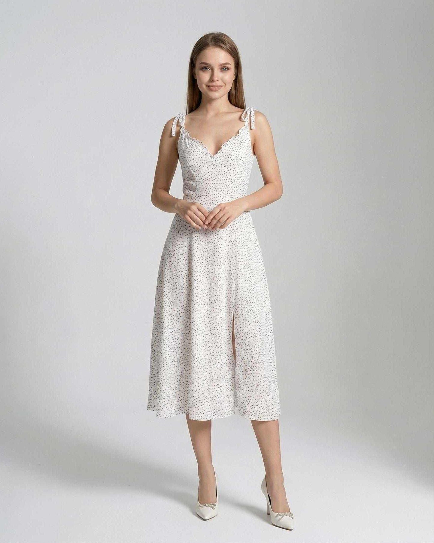Elara Midi Dress by Lauven featuring elegant A-line silhouette and polka dot details.