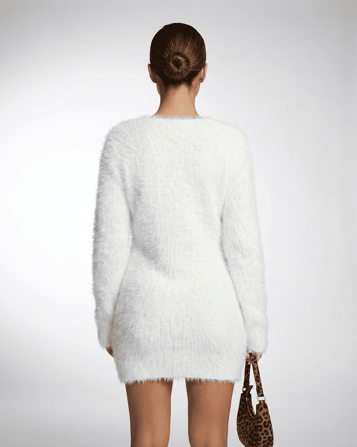 Elara Sweater by SLIMONA, showcasing a cozy plush knit design in white, perfect for fall and winter wardrobes.