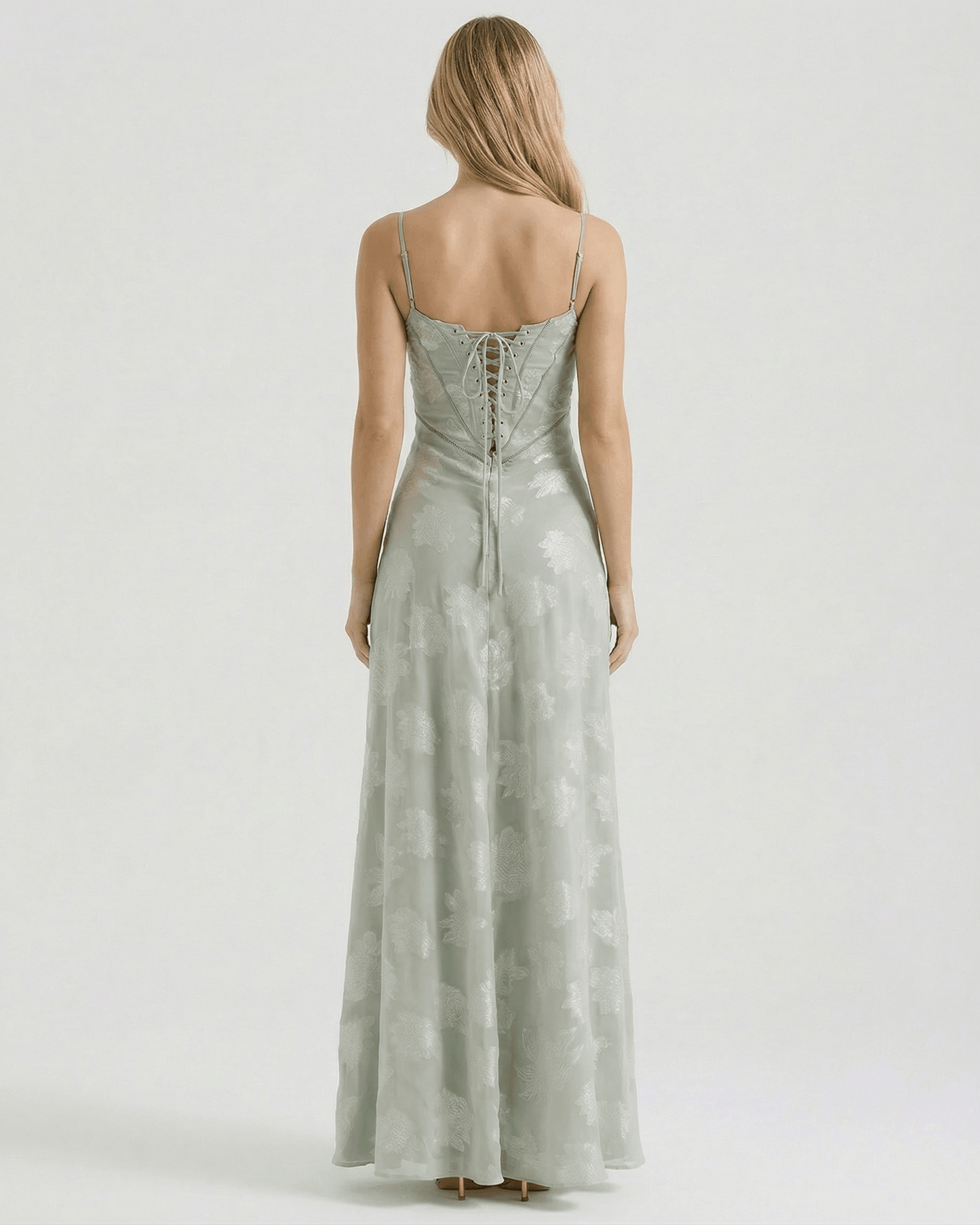 Back view of Eliara Maxi Dress by Lauven, featuring sheer floral print and lace-up detailing.