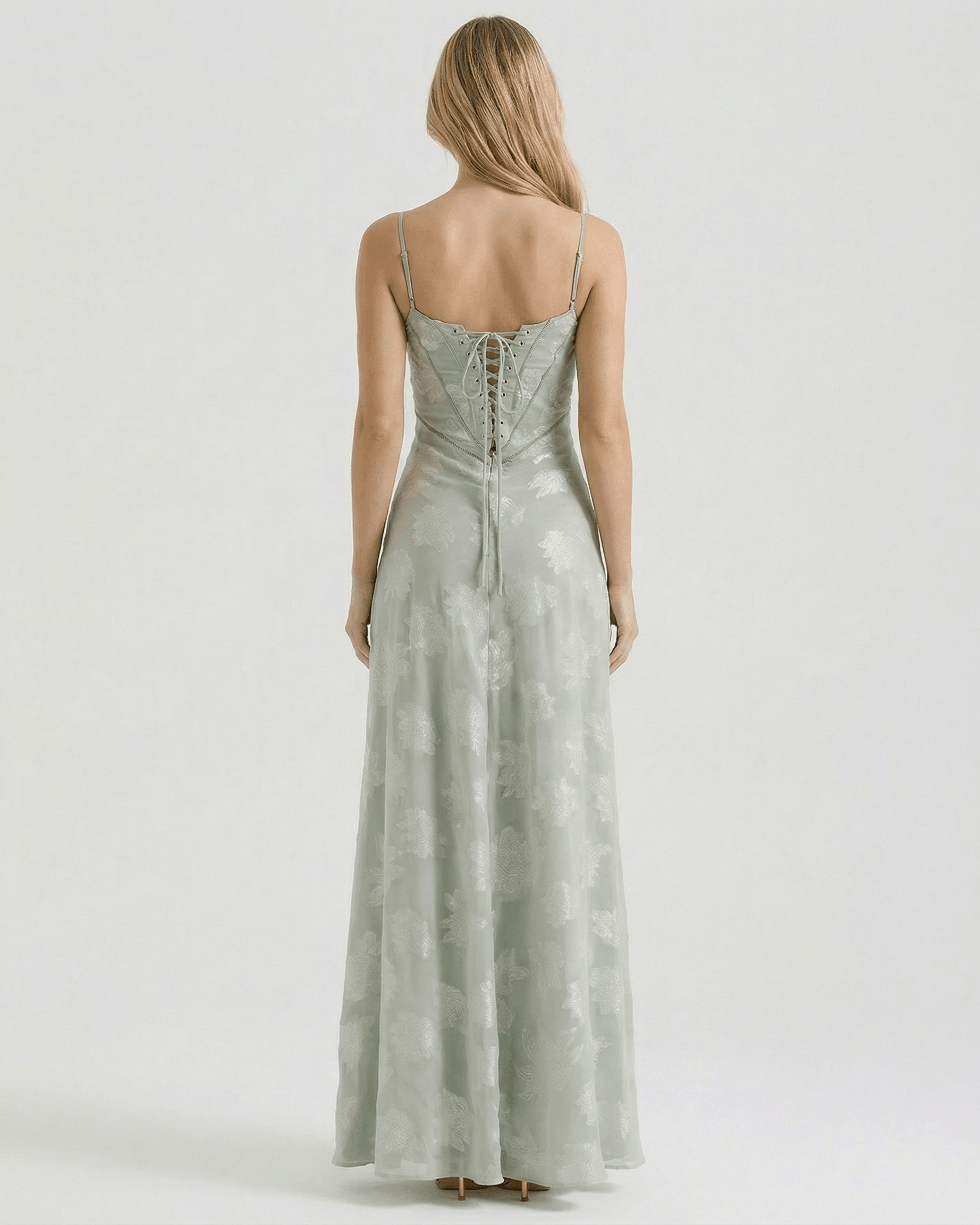 Back view of Eliara Maxi Dress by Lauven, featuring sheer floral print and lace-up detailing.
