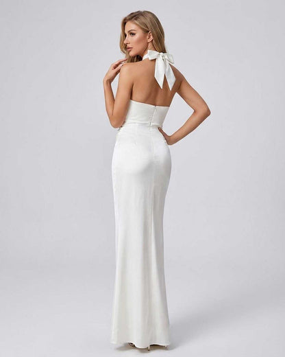 Elysia Maxi Dress by SLIMONA, elegant solid white halter neck bodycon dress from the back with stylish bow detail.