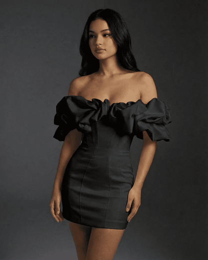 Elysia Mini Dress by SLIMONA, featuring off-the-shoulder design and ruffle trim in classic black.