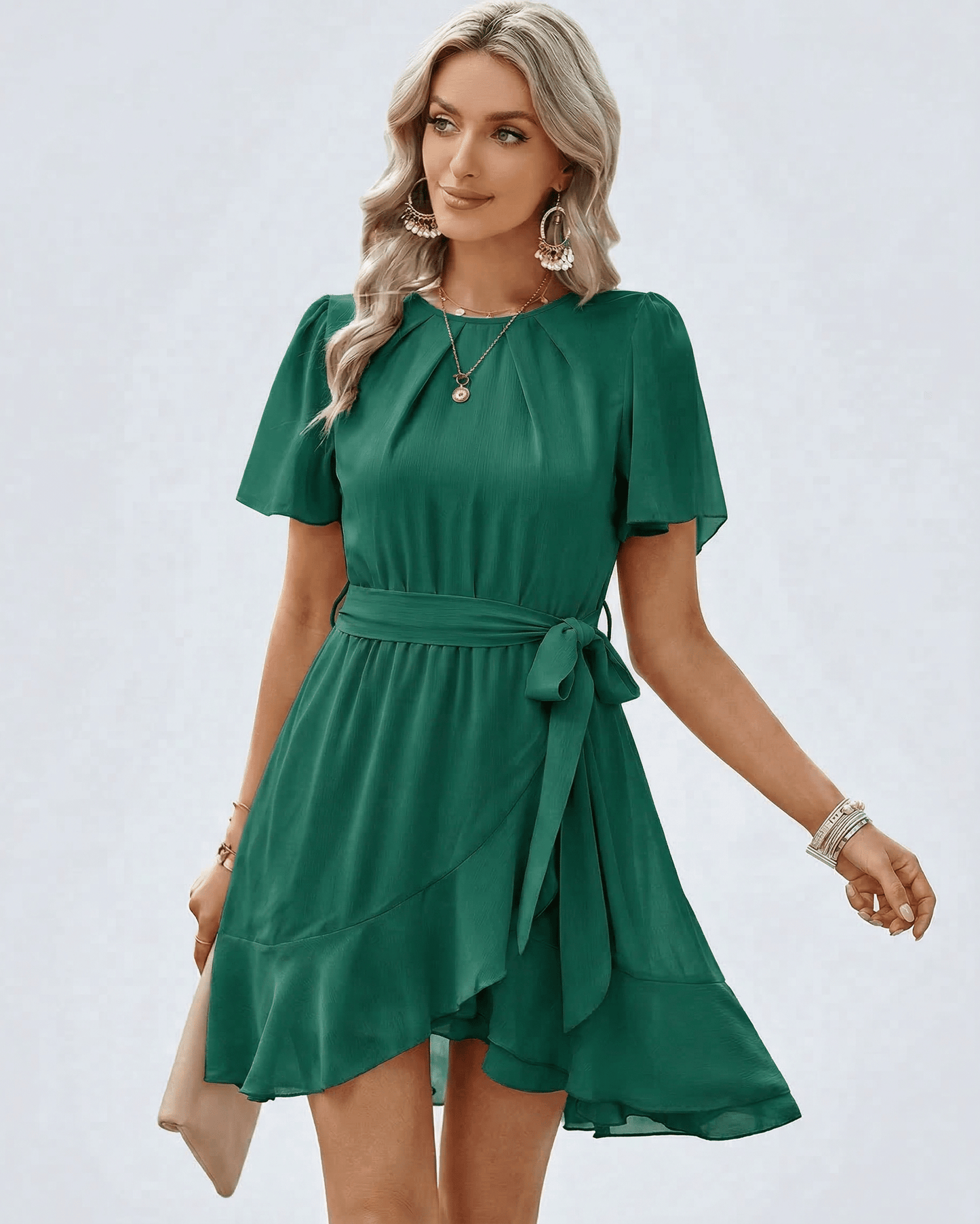 Emerald Ruffle Dress by Lauven featuring soft flutter sleeves and a flattering waist tie, showcasing elegance in rich green.