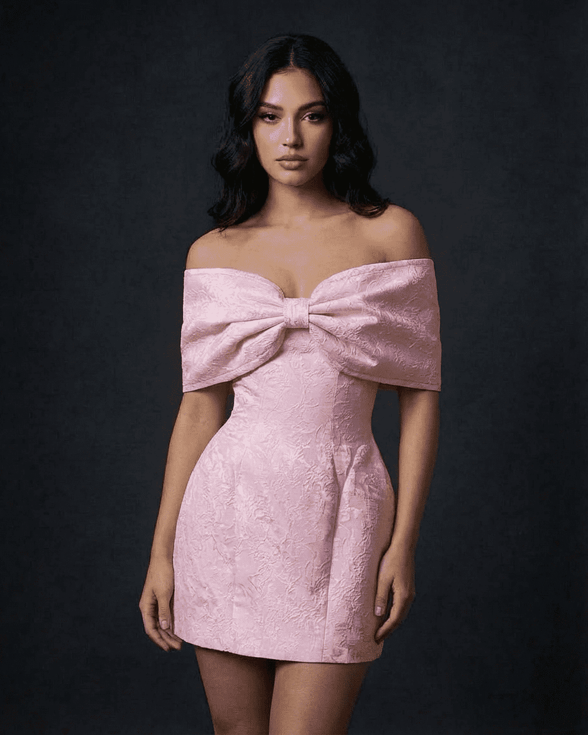 Fiora Mini Dress by SLIMONA, featuring an off-the-shoulder design with a large bowknot in soft pink.