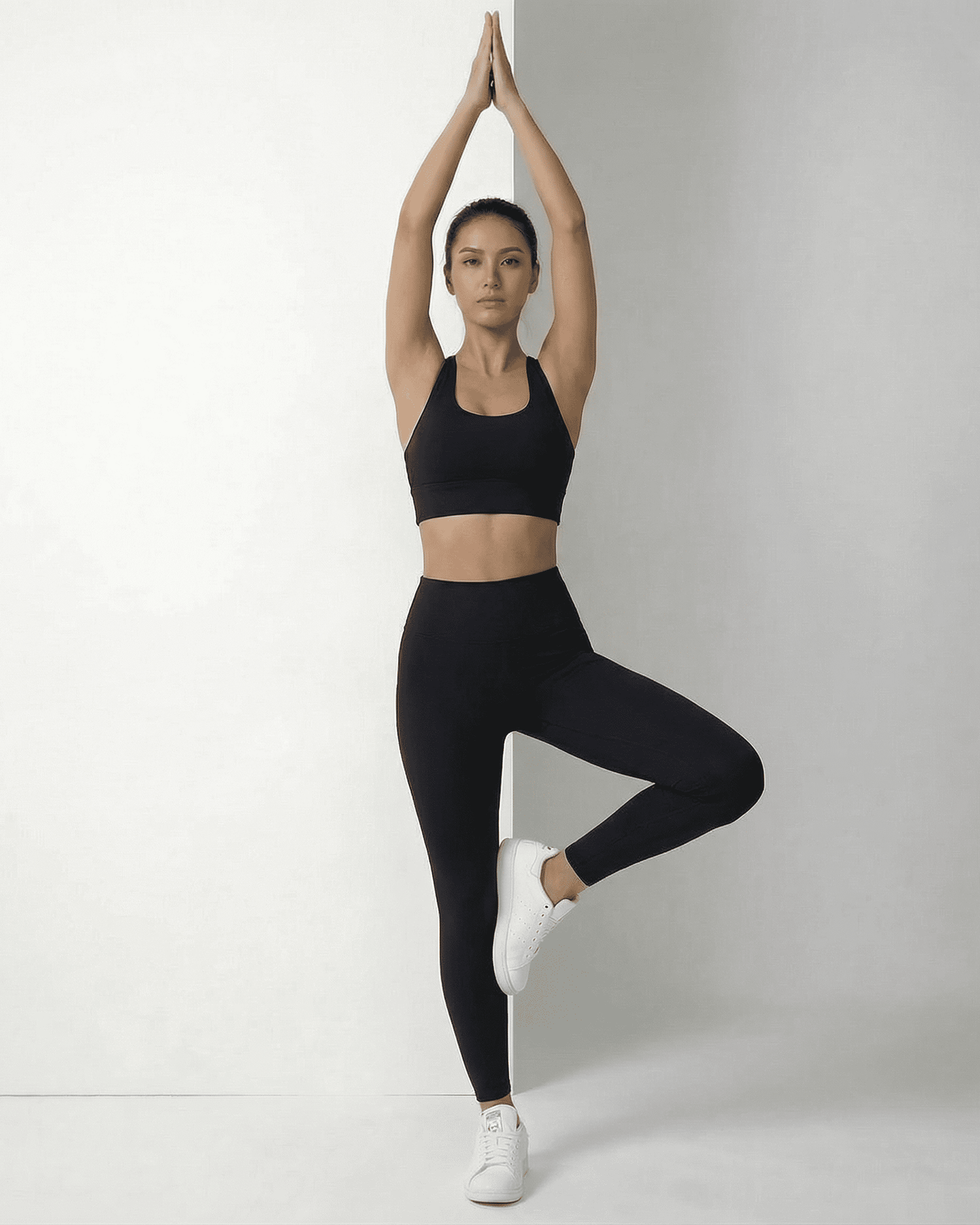 Iris Leggings Black worn by a model, showcasing a sleek fit and stylish look from SLIMONA.