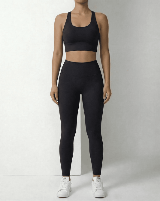 Iris Leggings Black from SLIMONA, sleek ankle-length leggings with pockets for comfort and style.