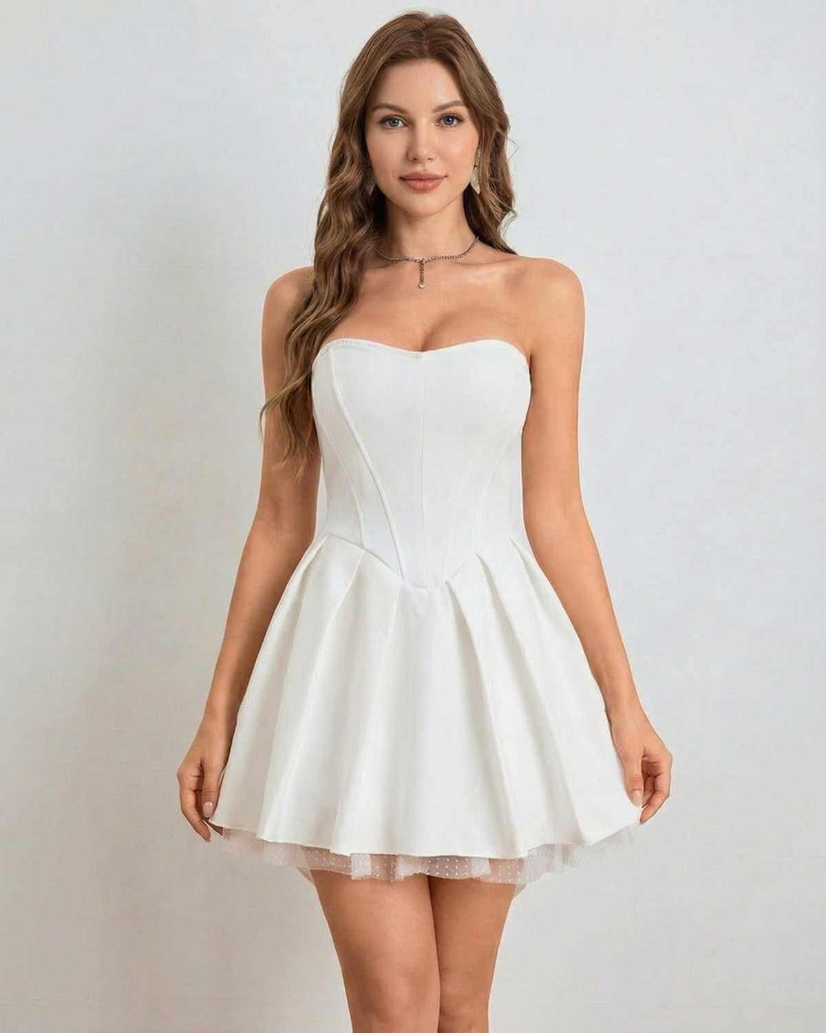 Ivoria Mini Dress by SLIMONA, strapless high-waist design with softly flared skirt in elegant white.