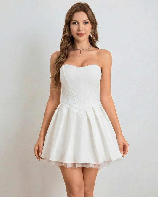 Ivoria Mini Dress by SLIMONA, strapless high-waist design with softly flared skirt in elegant white.