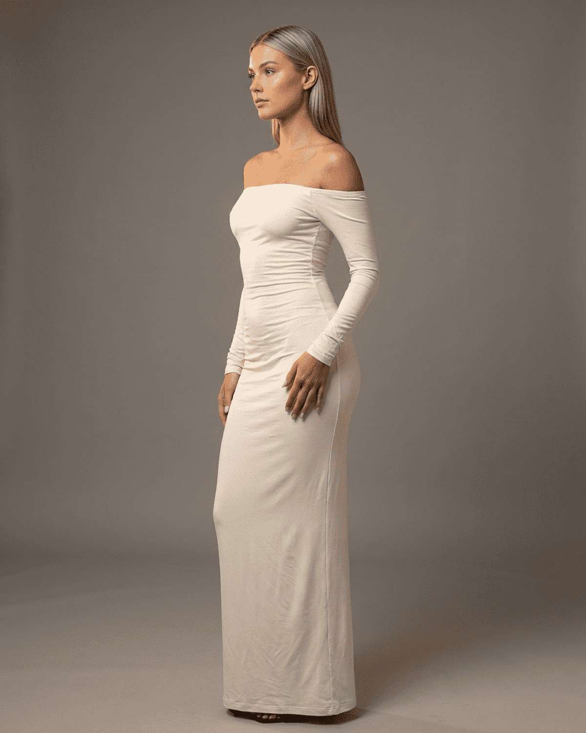 Ivory Maxi Dress by SLIMONA - Elegant off-shoulder design with long sleeves, perfect for any occasion.