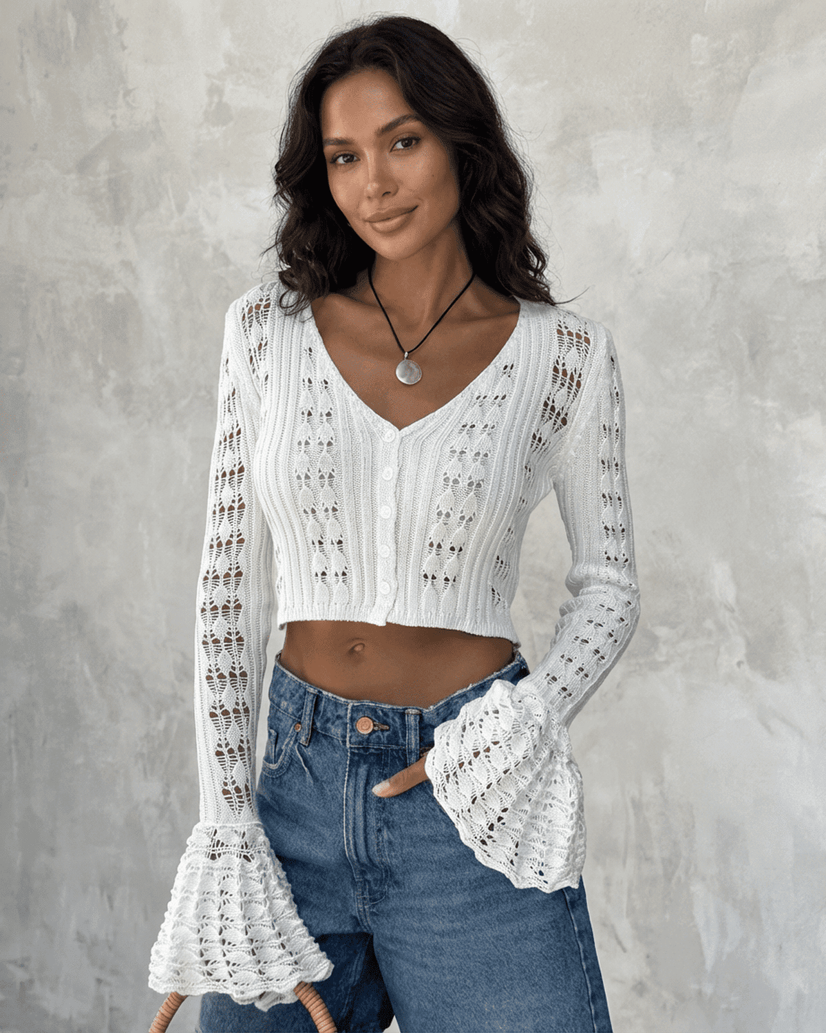 Model wearing Laceflare Cardigan by SLIMONA, featuring elegant lace details and dramatic flare sleeves.