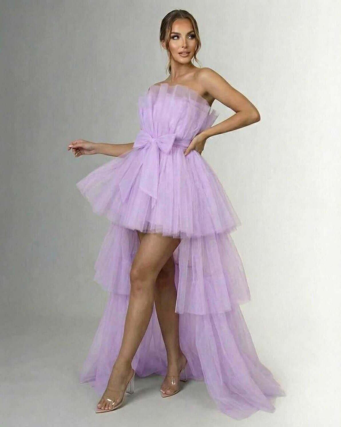 Lilacina Maxi Dress by Lauven, a strapless tulle high-low gown in soft lilac with a bow detail at the waist.