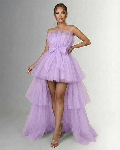 Lilacina Maxi Dress by Lauven – Strapless lilac tulle gown with high-low hem and bow detail at the waist.