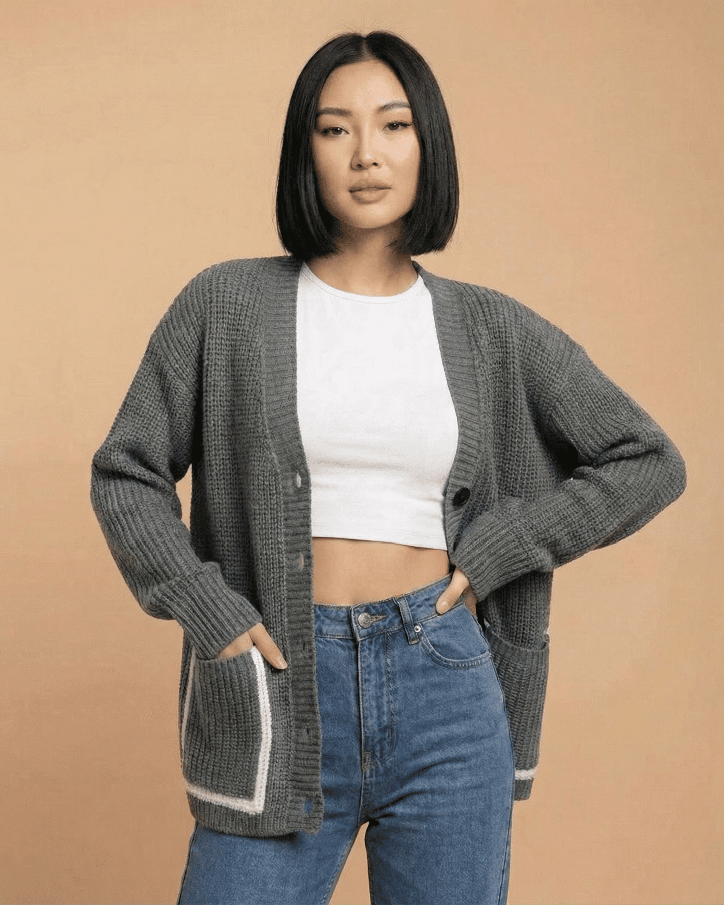 Linden Cardigan by SLIMONA, featuring a relaxed V-neck and color block knit design, perfect for stylish layering.