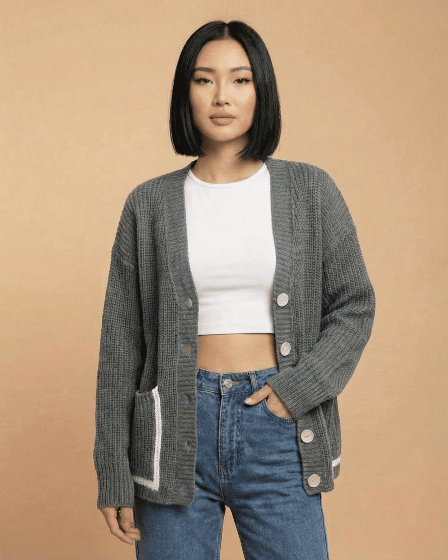 Linden Cardigan by SLIMONA in gray, featuring a relaxed V-neck and button-front design for stylish layering.