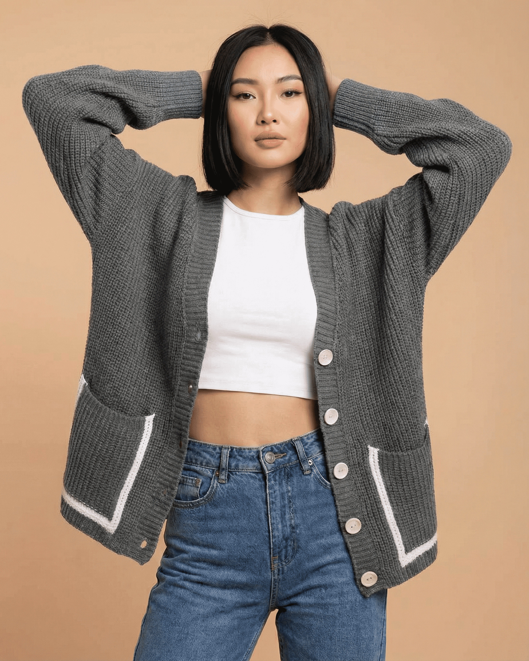 Linden Cardigan by SLIMONA, relaxed V-neck color block knit cardigan with pockets and button-front closure.