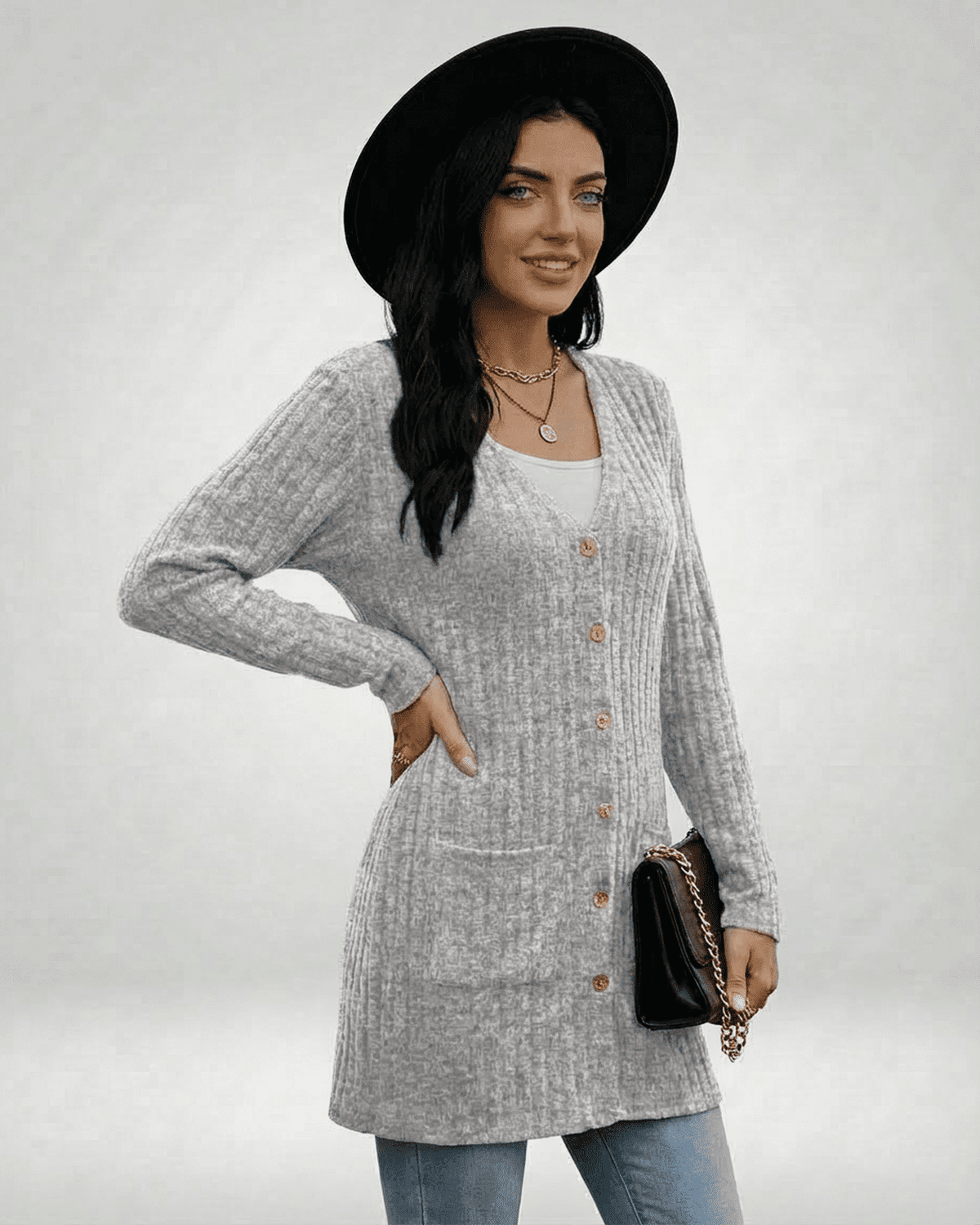 Model wearing Luna Cardigan by SLIMONA, a stylish gray longline knitwear with button front and pockets.