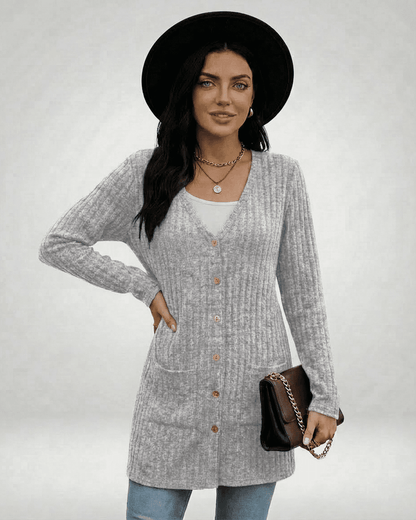 Model wearing a stylish Luna Cardigan by SLIMONA, featuring a longline silhouette and button-front design.