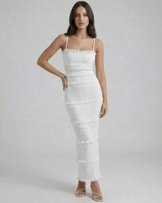 Luna Maxi Dress by Lauven featuring a sleek sheath silhouette in crisp white with spaghetti straps and subtle pleating.