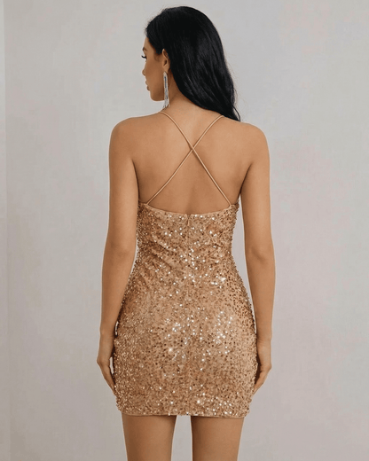 Back view of the Luna Mini Dress by SLIMONA, featuring a stunning gold sequin design and crisscross straps.