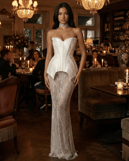 Lunaria Maxi Dress by SLIMONA, a strapless lace patchwork gown with a corset bodice and sheer skirt.